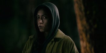 Movie still from “Sayen” (2023), directed by Alexander Witt – A woman in a hooded jacket looking at the camera; Close Up shot, Low angle