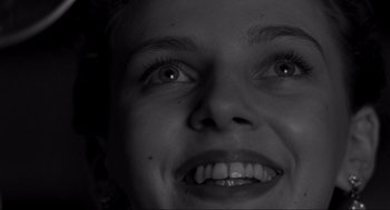 Movie still from “Schindler's List” (1993), directed by Steven Spielberg – A woman's eyes and mouth; Extreme Close Up shot, Low angle