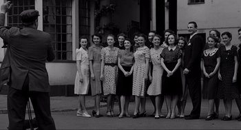 Movie still from “Schindler's List” (1993), directed by Steven Spielberg – A black and white photo of a group of young women; Wide shot, Low angle