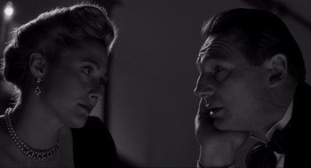 Movie still from “Schindler's List” (1993), directed by Steven Spielberg – A man and a woman looking at one another; Close Up shot, Low angle