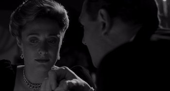 Movie still from “Schindler's List” (1993), directed by Steven Spielberg – An old photo of a man and a woman; Close Up shot, Over the shoulder angle