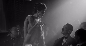 Movie still from “Schindler's List” (1993), directed by Steven Spielberg – A man and a woman are talking to each other; Medium shot, Over the shoulder angle