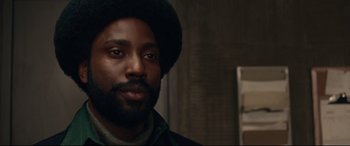 Movie still from “BlacKkKlansman” (2018), directed by Spike Lee – A person with a beard; Close Up shot, Low angle