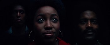 Movie still from “BlacKkKlansman” (2018), directed by Spike Lee – A person wearing a red shirt; Close Up shot, Low angle