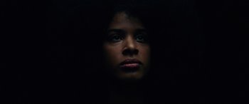 Movie still from “BlacKkKlansman” (2018), directed by Spike Lee – A young woman is looking into the camera; Close Up shot, Low angle