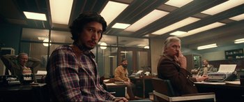 Movie still from “BlacKkKlansman” (2018), directed by Spike Lee – A group of people sitting in a room; Medium shot, Over the shoulder angle