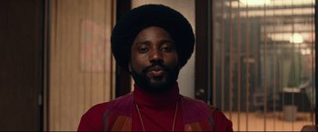Movie still from “BlacKkKlansman” (2018), directed by Spike Lee – A person with a beard; Close Up shot, Low angle