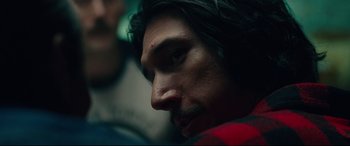 Movie still from “BlacKkKlansman” (2018), directed by Spike Lee – A person with long hair; Close Up shot, Over the shoulder angle