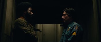 Movie still from “BlacKkKlansman” (2018), directed by Spike Lee – A man and a woman talking to each other; Medium shot, Over the shoulder angle