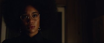 Movie still from “BlacKkKlansman” (2018), directed by Spike Lee – A person wearing glasses; Close Up shot, Low angle