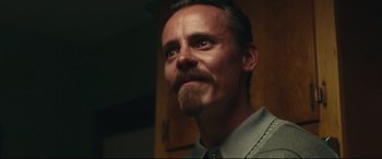 Movie still from “BlacKkKlansman” (2018), directed by Spike Lee – A person with a beard; Close Up shot, Low angle