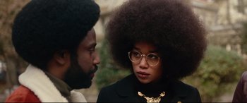 Movie still from “BlacKkKlansman” (2018), directed by Spike Lee – A man and a woman talking to each other; Close Up shot, Over the shoulder angle