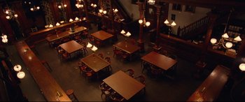 Movie still from “BlacKkKlansman” (2018), directed by Spike Lee – An overhead view of tables and chairs in a restaurant; Extreme Wide shot, High angle
