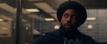 Movie still from “BlacKkKlansman” (2018), directed by Spike Lee – A person with a beard; Close Up shot, Low angle
