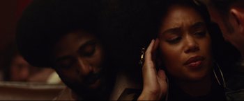 Movie still from “BlacKkKlansman” (2018), directed by Spike Lee – A man and a woman talking on a cell phone; Close Up shot, Overhead angle