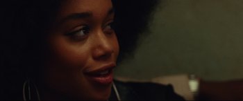 Movie still from “BlacKkKlansman” (2018), directed by Spike Lee – A person wearing headphones; Close Up shot, Over the shoulder angle
