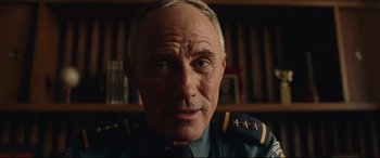 Movie still from “BlacKkKlansman” (2018), directed by Spike Lee – An older man wearing a military uniform in front of a book shelf; Close Up shot, Low angle