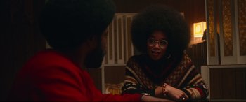 Movie still from “BlacKkKlansman” (2018), directed by Spike Lee – A man and a woman sitting in front of each other; Medium shot, Over the shoulder angle