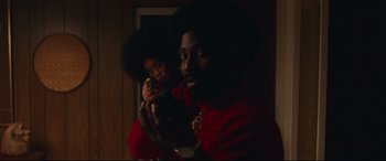 Movie still from “BlacKkKlansman” (2018), directed by Spike Lee – A man and a woman in a room with a mirror; Medium shot, Over the shoulder angle