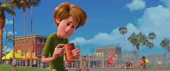 Movie still from “Scoob!” (2020), directed by Tony Cervone – A cartoon of a boy eating a sandwich; Medium shot, Over the shoulder angle