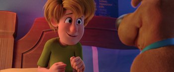 Movie still from “Scoob!” (2020), directed by Tony Cervone – A cartoon of a boy looking at a camera; Close Up shot, Over the shoulder angle