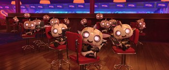 Movie still from “Scoob!” (2020), directed by Tony Cervone – A group of people that are sitting in chairs; Wide shot, High angle