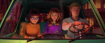 Movie still from “Scoob!” (2020), directed by Tony Cervone – A group of people sitting in a vehicle; Medium shot, Over the shoulder angle