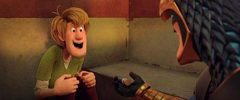 Movie still from “Scoob!” (2020), directed by Tony Cervone – A man is holding something in his hand while another man is holding something in his other hand; Medium shot, Over the shoulder angle