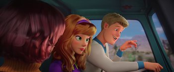 Movie still from “Scoob!” (2020), directed by Tony Cervone – A couple of people that are in a car together; Close Up shot, Over the shoulder angle