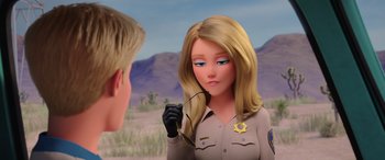 Movie still from “Scoob!” (2020), directed by Tony Cervone – A woman in a sheriff's uniform holding a pair of glasses; Close Up shot, Over the shoulder angle
