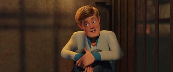 Movie still from “Scoob!” (2020), directed by Tony Cervone – A cartoon of a man sitting on the ground; Medium shot, High angle