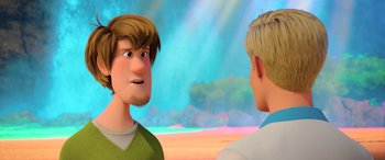 Movie still from “Scoob!” (2020), directed by Tony Cervone – Two cartoon characters are talking to one another; Close Up shot, Over the shoulder angle