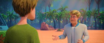 Movie still from “Scoob!” (2020), directed by Tony Cervone – Two animated people are talking in the desert; Medium shot, Over the shoulder angle