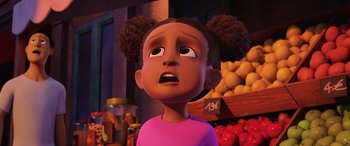 An animated girl with a surprised look on her face in front of a fruit stand