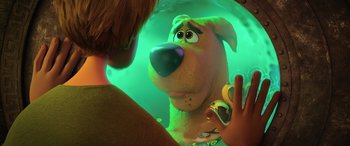 Movie still from “Scoob!” (2020), directed by Tony Cervone – A man is looking at a dog in a mirror; Close Up shot, Over the shoulder angle