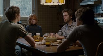Movie still from “Scott Pilgrim vs. the World” (2010), directed by Edgar Wright – A group of people sitting at a table with food; Medium shot, Over the shoulder angle