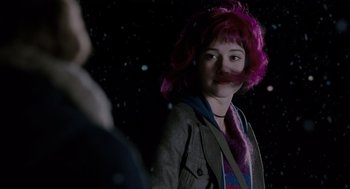 Movie still from “Scott Pilgrim vs. the World” (2010), directed by Edgar Wright – A woman with pink hair standing next to a man; Medium shot, Over the shoulder angle