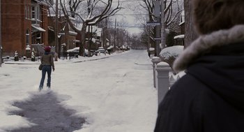 Movie still from “Scott Pilgrim vs. the World” (2010), directed by Edgar Wright – A person walking down a snow covered sidewalk; Extreme Wide shot, High angle