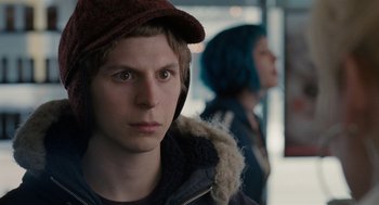 Movie still from “Scott Pilgrim vs. the World” (2010), directed by Edgar Wright – A young man wearing a hat and a jacket; Close Up shot, Over the shoulder angle