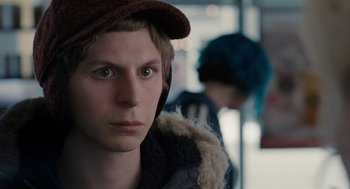 Movie still from “Scott Pilgrim vs. the World” (2010), directed by Edgar Wright – A young man with a hat on looking into the distance; Close Up shot, Over the shoulder angle