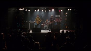Movie still from “Scott Pilgrim vs. the World” (2010), directed by Edgar Wright – A group of people on a stage playing a band; Extreme Wide shot, Overhead angle