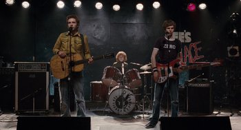 Movie still from “Scott Pilgrim vs. the World” (2010), directed by Edgar Wright – A group of people that are on a stage; Wide shot, Low angle