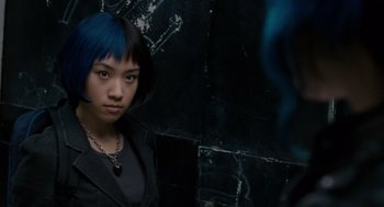 Movie still from “Scott Pilgrim vs. the World” (2010), directed by Edgar Wright – A woman with blue hair and a black jacket looking at the camera; Close Up shot, Over the shoulder angle