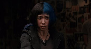 Movie still from “Scott Pilgrim vs. the World” (2010), directed by Edgar Wright – A woman with blue and black hair in a dark room; Close Up shot, Over the shoulder angle