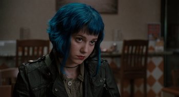 Movie still from “Scott Pilgrim vs. the World” (2010), directed by Edgar Wright – A woman with blue hair sitting in front of a table; Close Up shot, Over the shoulder angle