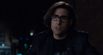 Movie still from “Scott Pilgrim vs. the World” (2010), directed by Edgar Wright – A man with long hair wearing glasses and a black jacket; Close Up shot, Over the shoulder angle