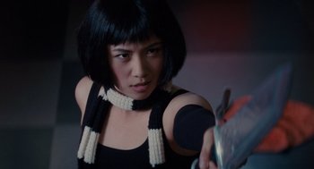 Movie still from “Scott Pilgrim vs. the World” (2010), directed by Edgar Wright – A woman in black shirt and black and white scarf; Close Up shot, Low angle