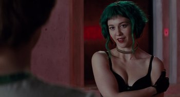 Movie still from “Scott Pilgrim vs. the World” (2010), directed by Edgar Wright – A woman with green hair sitting next to a wall; Close Up shot, Over the shoulder angle