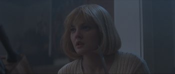 Movie still from “Scream” (1996), directed by Wes Craven – A woman with blonde hair is looking to her left; Close Up shot, Low angle