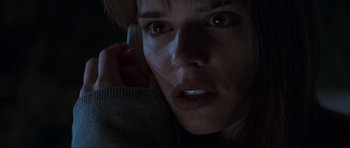 Movie still from “Scream” (1996), directed by Wes Craven – A person talking on a cell phone; Close Up shot, Low angle